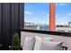 Relaxing balcony offers beautiful mountain views beyond neighboring rooftops, creating a peaceful urban retreat at 3040 Wilson Ct # 2, Denver, CO 80205