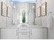 Modern bathroom featuring dual sinks, contemporary mirrors, and modern lighting at 3040 Wilson Ct # 2, Denver, CO 80205