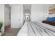 Bright bedroom with a walk-in closet and ensuite bathroom entrance at 3040 Wilson Ct # 2, Denver, CO 80205
