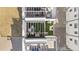 Aerial view of rooftop patios with outdoor seating, pergolas, and turf areas at 3040 Wilson Ct # 2, Denver, CO 80205