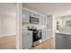 Modern kitchen with gray cabinets and stainless steel appliances at 5483 S Versailles St, Aurora, CO 80015