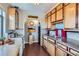 Quaint kitchen with wood cabinets and tile countertops providing a unique and functional space at 1175 N Emerson St # 312, Denver, CO 80218