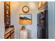 A view of the pantry with cabinets, mountain artwork, and a refrigerator at 1175 N Emerson St # 312, Denver, CO 80218