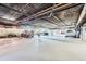 Parking garage featuring concrete ceiling, flooring, and parking spaces at 1175 N Emerson St # 312, Denver, CO 80218