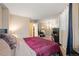 Spacious bedroom with a large bed and mirrored closet at 601 W 11Th Ave # 414, Denver, CO 80204