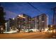 Night view of a multi-story apartment building with street parking at 601 W 11Th Ave # 414, Denver, CO 80204