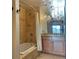 Elegant bathroom featuring a shower-over-tub, vanity, and chandelier at 925 N Lincoln St # 14C, Denver, CO 80203