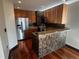 Kitchen with stainless steel appliances, granite countertops, and wood floors at 925 N Lincoln St # 14C, Denver, CO 80203