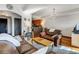 Inviting living room featuring hardwood floors, warm lighting, and comfortable leather seating at 925 N Lincoln St # 14C, Denver, CO 80203