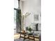Chic living room featuring a comfortable gray sofa and stylish decor at 3100 Huron St # 1B, Denver, CO 80202