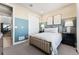 Comfortable bedroom featuring neutral carpet and large window with stylish decor at 4261 Ridgewalk Pt, Castle Rock, CO 80108