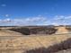 Expansive undeveloped landscape with blue sky and a distant mountain view at 4261 Ridgewalk Pt, Castle Rock, CO 80108