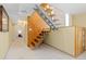 Finished basement stairs with alternating treads and wood paneled wall at 15000 W 29Th Ave, Golden, CO 80401