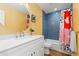 Bright bathroom features modern vanity, stylish mirror, and a shower-tub combination at 15000 W 29Th Ave, Golden, CO 80401