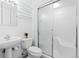 Bright, clean bathroom with a shower and glass shelving at 15000 W 29Th Ave, Golden, CO 80401