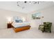 Bright bedroom with a large bed, window, and accent chair at 15000 W 29Th Ave, Golden, CO 80401