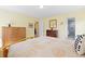 Bright bedroom featuring yellow walls and views into an adjacent bathroom with glass shower at 15000 W 29Th Ave, Golden, CO 80401