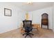 Bedroom with neutral walls configured as an office and a view into the hallway at 15000 W 29Th Ave, Golden, CO 80401