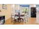 Bright dining area adjacent to the kitchen with sliding glass doors and a modern dining table at 15000 W 29Th Ave, Golden, CO 80401