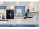 This stylish kitchen features custom tile backsplash, granite countertops, and stainless steel appliances at 15000 W 29Th Ave, Golden, CO 80401