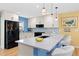 Bright kitchen features granite countertops, stainless steel appliances, and a breakfast bar at 15000 W 29Th Ave, Golden, CO 80401