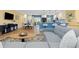 Spacious living room featuring modern kitchen, breakfast bar, and dining area at 15000 W 29Th Ave, Golden, CO 80401