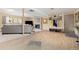 Open living space with light floors, a corner fireplace, and a comfortable seating area at 15000 W 29Th Ave, Golden, CO 80401
