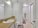 Well-lit bathroom with a sink, toilet, and bathtub at 17825 E Carolina Pl, Aurora, CO 80017