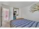 Bedroom with a closet and tree art at 17825 E Carolina Pl, Aurora, CO 80017