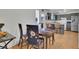 Cozy dining area with wood table and decorative floral-patterned chair covers at 17825 E Carolina Pl, Aurora, CO 80017