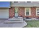 Inviting front entrance with steps, brick detail, and well-manicured landscaping, showcasing home's curb appeal at 17825 E Carolina Pl, Aurora, CO 80017