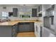 Kitchen featuring gray cabinets, wood countertops, and stainless steel refrigerator at 17825 E Carolina Pl, Aurora, CO 80017