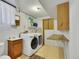 Convenient laundry room equipped with modern appliances and ample storage space at 17825 E Carolina Pl, Aurora, CO 80017
