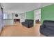Open-concept living room boasts hardwood floors and a comfortable seating arrangement at 17825 E Carolina Pl, Aurora, CO 80017