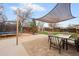 The spacious backyard provides outdoor entertainment and dining with a patio, dining set, and shade at 3308 E 118Th Way, Thornton, CO 80233