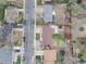 Aerial view of a home showcasing a well-maintained backyard with a patio, lawn and mature trees at 3308 E 118Th Way, Thornton, CO 80233
