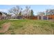 This expansive backyard features a lush lawn, shed, playset, trampoline and a dining set for outdoor enjoyment at 3308 E 118Th Way, Thornton, CO 80233