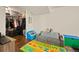 Functional bedroom area with closet, play area, and desk offers versatile living space at 3308 E 118Th Way, Thornton, CO 80233