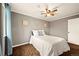 Cozy bedroom featuring plush carpet, natural light, and a serene color scheme creating a relaxing space at 3308 E 118Th Way, Thornton, CO 80233