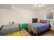 A simple ' bedroom with a twin bed, toys, and a seating area provides a playful space at 3308 E 118Th Way, Thornton, CO 80233