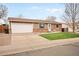 Charming single-story home with a well-maintained front yard, brick accents, and an attached two-car garage at 3308 E 118Th Way, Thornton, CO 80233