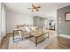 Bright living room with open layout, hardwood floors, and neutral decor at 3308 E 118Th Way, Thornton, CO 80233