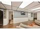 Relax in the finished basement with recessed lighting, modern gray walls and easy access to the laundry room at 3308 E 118Th Way, Thornton, CO 80233