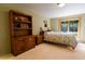 Bedroom with carpet floors, natural light and wood shelving providing functionality and comfort at 446 Blue River Rd, Breckenridge, CO 80424