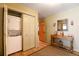 Hallway with washer and dryer space, providing convenient laundry solutions and access to other rooms at 446 Blue River Rd, Breckenridge, CO 80424