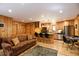 Open concept living space with an adjacent kitchen featuring a granite countertop island and bar seating at 446 Blue River Rd, Breckenridge, CO 80424