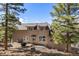 Charming backyard with a wooden deck, perfect for relaxing and enjoying the serene outdoor setting at 6530 Ridgeview Dr, Morrison, CO 80465