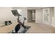 Finished basement with exercise area, complete with a Peloton bike and nearby bathroom at 6530 Ridgeview Dr, Morrison, CO 80465