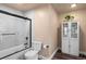 Clean and stylish bathroom featuring a tiled shower with glass door, and a modern storage cabinet at 6530 Ridgeview Dr, Morrison, CO 80465