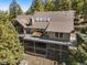 Expansive home featuring a large deck with seating area, offering an ideal outdoor living space at 6530 Ridgeview Dr, Morrison, CO 80465